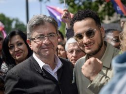 Taha Bouhafs aux côtés de Jean-Luc Mélenchon lors du 1er mai
