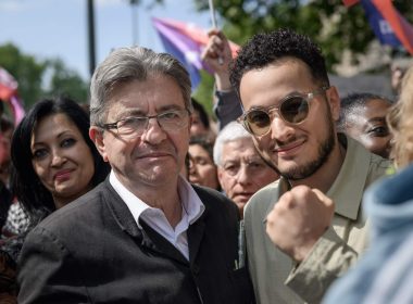 Taha Bouhafs aux côtés de Jean-Luc Mélenchon lors du 1er mai