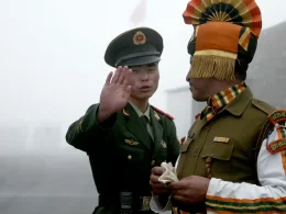 A Chinese and an Indian soldier at the Nathu La border crossing in India’s north-eastern Sikkim state in 2008. Photograph: Diptendu Dutta/AFP/Getty Images