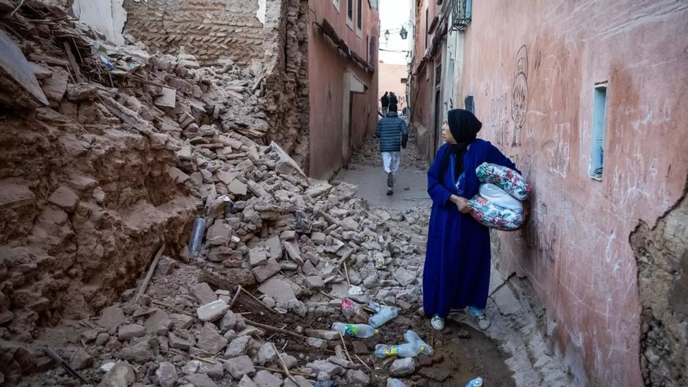 A woman surveys the damage to a building in Marrakesh, after the powerful earthquake struck overnight on Friday/ Getty images