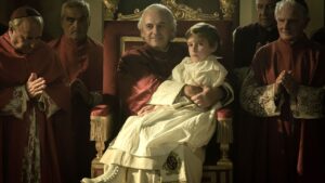 Edgardo est assis sur les genoux du pape