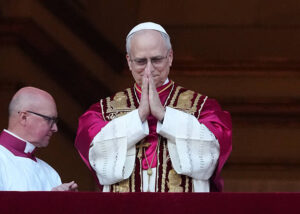 The newly elected Pontiff, Pope Leo XIV is seen for the first time from the Vatican balcony on May 8, 2025 in Vatican City (Photo by Christopher Furlong/Getty Images)
