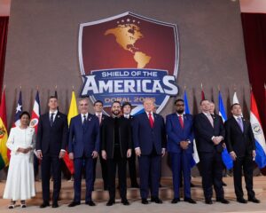 The ‘Shield of the Americas’ summit on 7 March 2026 in Doral, Florida. Front row: Kamla Persad-Bissessa of Trinidad and Tobago, Santiago Peña of Paraguay, Luis Abinader of the Dominican Republic, Nayib Bukele of El Salvador, Donald Trump, Mohamed Irfaan Ali of Guyana, Rodrigo Chaves Robles of Costa Rica and Daniel Noboa of Ecuador. Back row: Rodrigo Paz Pereira of Bolivia, Javier Milei of Argentina, José Raúl Mulino of Honduras and Jose Antonio Kast of Chile. Photograph: Mark Schiefelbein/AP